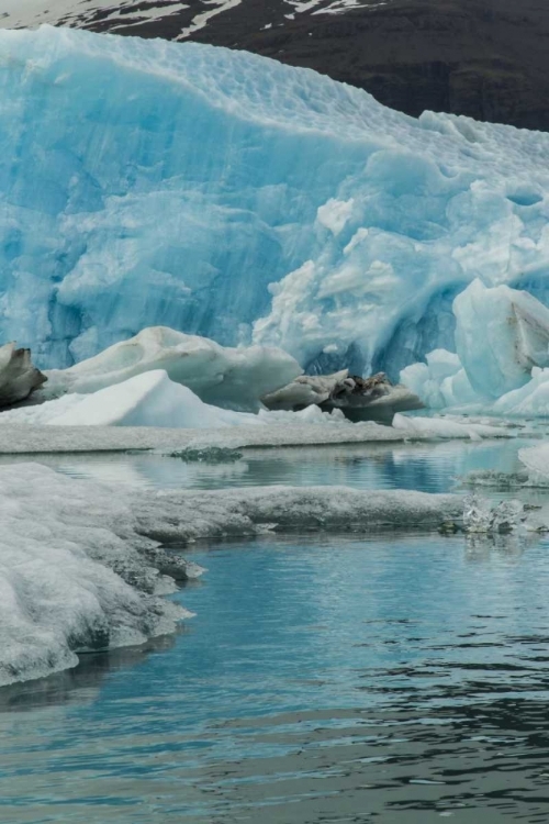 Picture of ICELAND, JOKUSARLON ICEBERG REFLECTS IN WATER