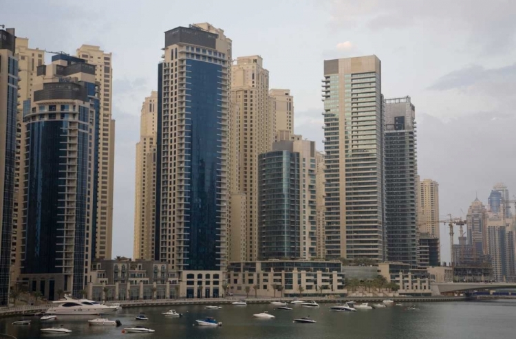 Picture of UAE, DUBAI MODERN BUILDINGS TOWER OVER BOATS