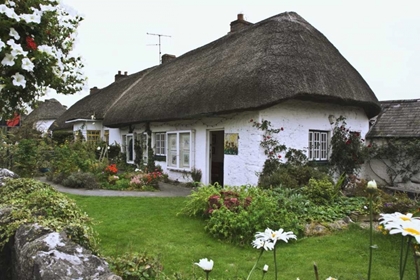 Picture of IRELAND, ADARE COTTAGE SURROUNDED BY A GARDEN
