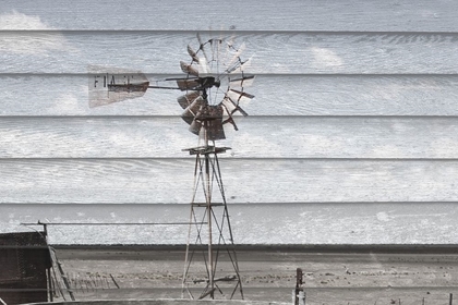 Picture of RUSTED WINDMILL ON WOOD