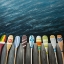 Picture of COLORFUL PADDLES ON THE DOCK