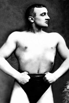 Picture of BODYBUILDER WITH THUMBS TUCKED IN BELT