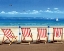 Picture of FOUR RED DECKCHAIRS