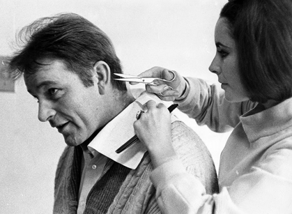 Picture of ELIZABETH TAYLOR TRIMS RICHARD BURTONS HAIR