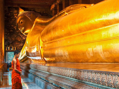 Picture of PRAYING THE RECLINED BUDDHA, WAT PHO, BANGKOK, THAILAND