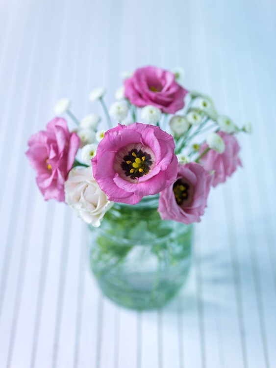 Picture of COLORFUL LISIANTHUS FLOWERS IN GLASS BOTTLE