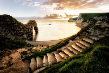 Picture of SUNSET AT DURDLE DOOR WITH PATHWAY. DORSET, JURASSIC COAST, ENGLAND