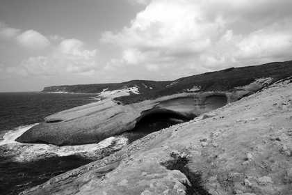 Picture of FLAT ROCKS WITH NATURAL ARCH ON THE COAST OF SARDINIA ISLAND ? BLACK AND WHITE