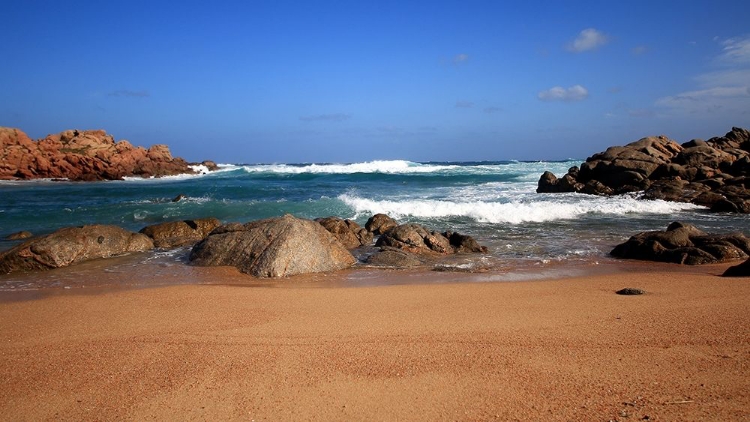 Picture of BLUE SEA WITH WAVES CRASHING ON RED ROCKS