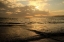 Picture of GOLDEN SEA AT SUNSET WITH A LIGHTHOUSE 