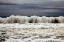 Picture of WAVES CRASHING ON THE COAST IN A CLOUDY DAY