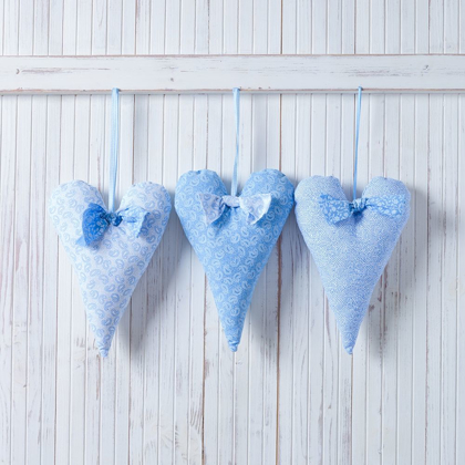 Picture of HEARTS HANGING ON WOODEN BACKGROUND