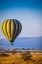 Picture of A HOT-AIR BALLOON SLOWLY TRAVERSES OVER THE SERENGETI PLAIN