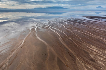 Picture of AFRICA-TANZANIA-AERIAL VIEW OF STREAMS WINDING ALONG SHORE AND DISTANT OL DOINYO LENGAI VOLCANO