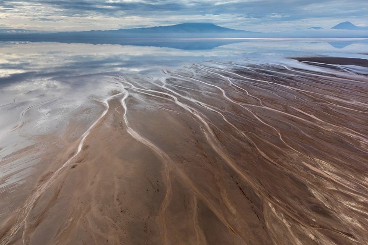 Picture of AFRICA-TANZANIA-AERIAL VIEW OF STREAMS WINDING ALONG SHORE AND DISTANT OL DOINYO LENGAI VOLCANO