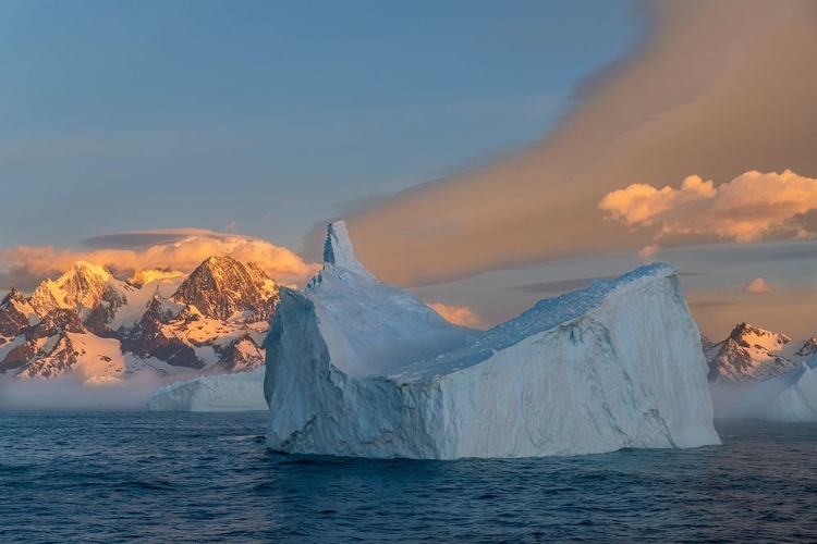 Picture of ANTARCTICA-SOUTH GEORGIA ISLAND-COOPERS BAY ICEBERG AND MOUNTAINS AT SUNRISE 