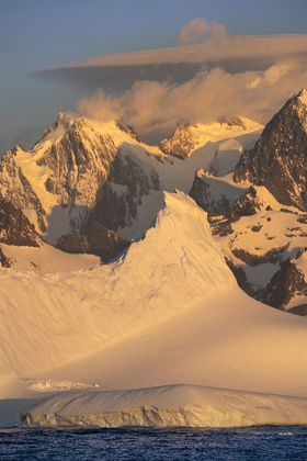 Picture of ANTARCTICA-SOUTH GEORGIA ISLAND-COOPERS BAY ICEBERG AND MOUNTAINS AT SUNRISE 