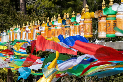 Picture of BHUTAN-PARO COLORFUL PRAYER WHEELS AND FLAGS ALONG THE HIKING TRAIL TO THE TIGERS NEST MONASTERY