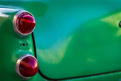 Picture of DETAIL OF TWO RED TAIL LIGHTS ON CLASSIC GREEN CAR IN TRINIDAD-CUBA
