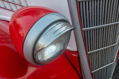 Picture of DETAIL OF HEAD LIGHT AND GRILL ON RED CLASSIC AMERICAN FORD IN HABANA-HAVANA-CUBA