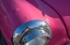 Picture of DETAIL OF CHROME HEAD LIGHT ON HOT PINK CLASSIC AMERICAN OLDSMOBILE-HAVANA-CUBA