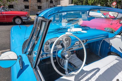 Picture of VIEW INTO DRIVERS SEAT OF A CLASSIC CONVERTIBLE BABY BLUE AMERICAN CAR PARKED IN VIEJA-HAVANA-CUBA