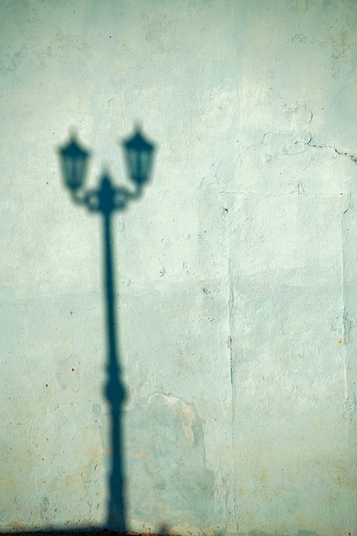 Picture of MORNING SHADOW OF A LAMPPOST ON LIGHT BLUE-GREEN HOUSE WALL IN TRINIDAD-CUBA