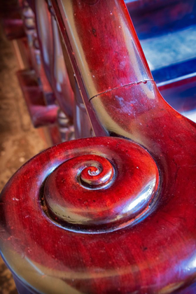 Picture of SNAIL SHELL-LIKE CURVE ON RED WOODEN BANNISTER HANDRAIL IN TRINIDAD-CUBA