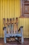 Picture of A DOG SLEEPS UNDER A WEATHERED ADIRONDACK ROCKING CHAIR IN VINALES-CUBA,