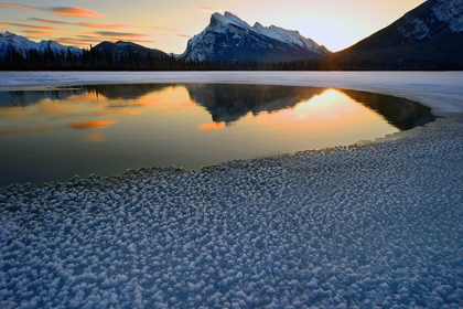 Picture of SNOW CRYSTALS RIM A LONE BREAK IN THE ICE ON VERMILION LAKES ON A COLD BANFF NATIONAL PARK WINTER MO