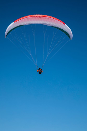 Picture of AUSTRIA-DACHSTEIN-PARAGLIDER SOARING ABOVE LAKE HALLSTATT AND THE SURROUNDING MOUNTAINS