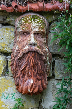 Picture of FRANCE-GIVERNY STONE FACE HANGING ON A STONE WALL 