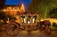 Picture of GERMANY-LINDAU ISLAND-LAKE CONSTANCE VICTORIAN ORNATE CARRIAGE IN FRONT OF HOTEL AT NIGHT
