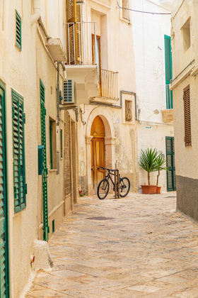 Picture of ITALY-APULIA-METROPOLITAN CITY OF BARI-MONOPOLI NARROW STREET BETWEEN BUILDINGS-WITH A BICYCLE