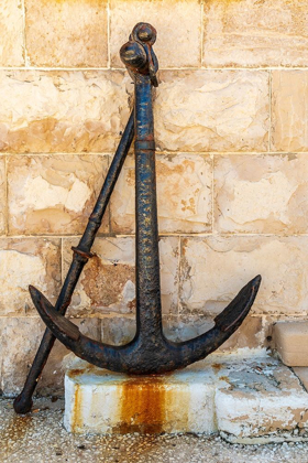 Picture of ITALY-APULIA-METROPOLITAN CITY OF BARI-GIOVINAZZO OLD RUSTED ANCHOR IN FRONT OF A STONE WALL