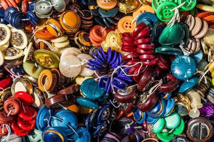 Picture of ITALY-APULIA-METROPOLITAN CITY OF BARI-LOCOROTONDO BUTTONS FOR SALE IN AN OUTDOOR MARKET