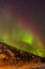 Picture of ALASKA-FAIRBANKS AURORA BOREALIS OVER MOUNTAIN LANDSCAPE