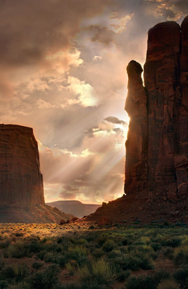 Picture of LIGHT RAYS FILTER DOWN INTO MONUMENT VALLEY-ON THE ARIZONA AND UTAH BORDER