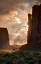 Picture of LIGHT RAYS FILTER DOWN INTO MONUMENT VALLEY-ON THE ARIZONA AND UTAH BORDER