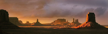 Picture of LAST LIGHT BATHES MONUMENT VALLEY IN DEEP ORANGES AND LAVENDERS ON THE ARIZONA-UTAH BORDER