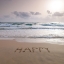Picture of SAND WRITING - WORD HAPPY WRITTEN ON BEACH