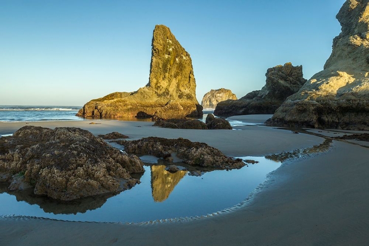 Picture of OREGON-BANDON BEACH ROCK FORMATIONS AND REFLECTION IN BEACH WATER 