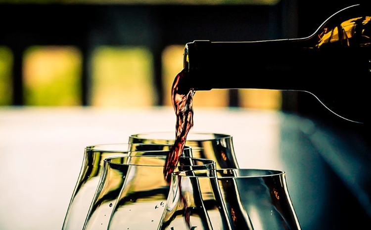 Picture of OREGON-WILLAMETTE VALLEY DRAMATIC POUR OF PINOT NOIR IN AN OREGON WINERY