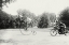 Picture of MOTORCYCLE COP CHASES A PENNY FARTHING VELOCIPEDE