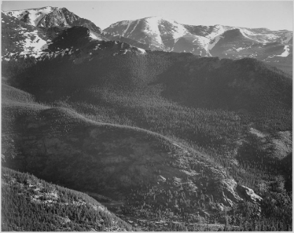 Picture of VIEW OF WOODED HILLS WITH MOUNTAINS IN BACKGROUND, IN ROCKY MOUNTAIN NATIONAL PARK, COLORADO, CA. 19