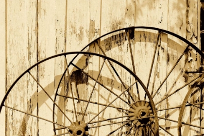 Picture of OLD WAGON WHEELS AGAINST A SHED IN BUFFALO GAP HISTORIC VILLAGE, NEAR ABILENE, TX - SEPIA