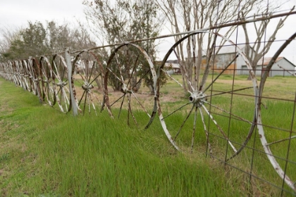 Picture of A FENCE MADE OF WAGON WHEELS NEAR SCHULENBURG IN FAYETTE COUNTY, TX