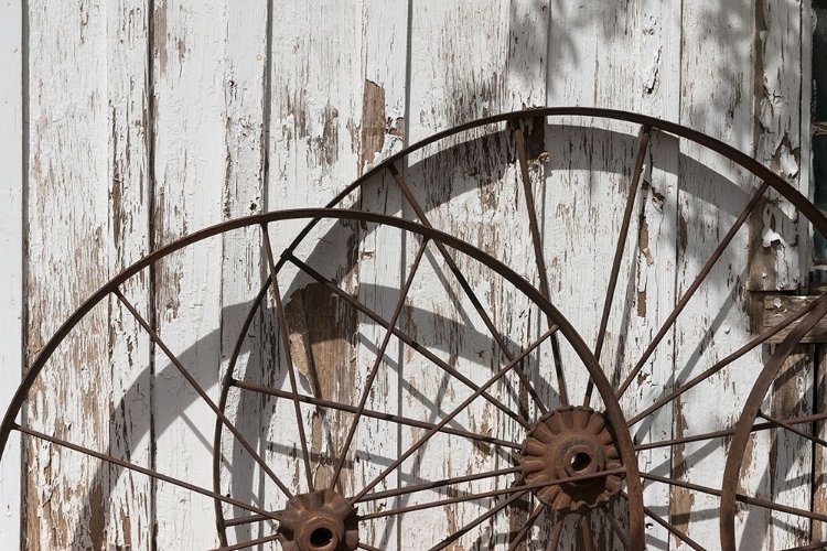 Picture of OLD WAGON WHEELS AGAINST A SHED IN BUFFALO GAP HISTORIC VILLAGE, NEAR ABILENE, TX