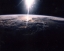 Picture of SUNLIGHT OVER EARTH AS SEEN BY DISCOVERY CREW