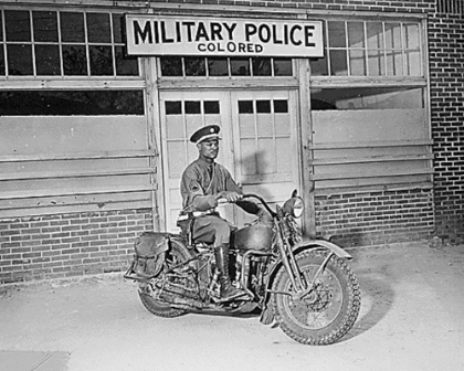 Picture of WWII AN MP ON MOTORCYCLE STANDS READY TO ANSWER ALL CALLS AROUND HIS AREA. COLUMBUS-GEORGIA